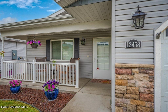 13458 N Bighorn Canyon St, Rathdrum, ID 83858 - property entrance with covered porch and stone siding