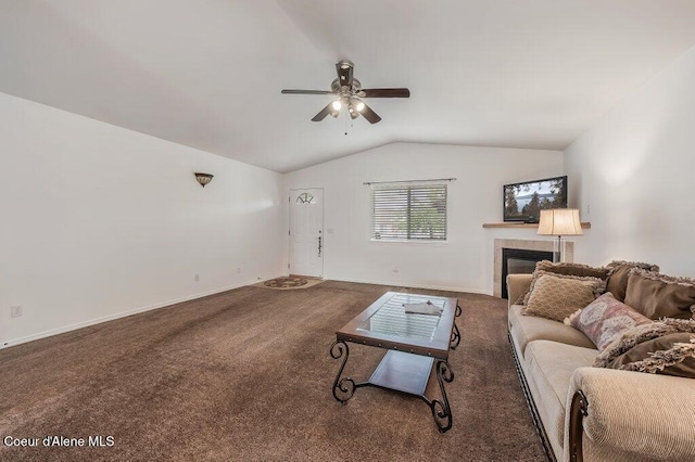 13458 N Bighorn Canyon St, Rathdrum, ID 83858 - living room featuring lofted ceiling, carpet floors, ceiling fan, a fireplace, and baseboards