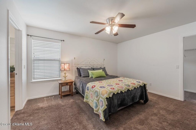 13458 N Bighorn Canyon St, Rathdrum, ID 83858 - carpeted bedroom featuring baseboards, ceiling fan, and a spacious closet
