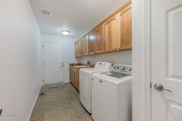 13458 N Bighorn Canyon St, Rathdrum, ID 83858 - washroom featuring separate washer and dryer, cabinet space, and baseboards