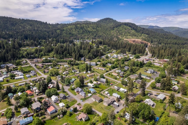 329 N 20th, Saint Maries, ID 83861 - aerial view of property's location featuring a heavily wooded area and a mountain backdrop