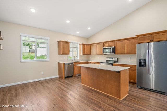 329 N 20th, Saint Maries, ID 83861 - kitchen with appliances with stainless steel finishes, light countertops, a sink, a center island, and dark wood finished floors