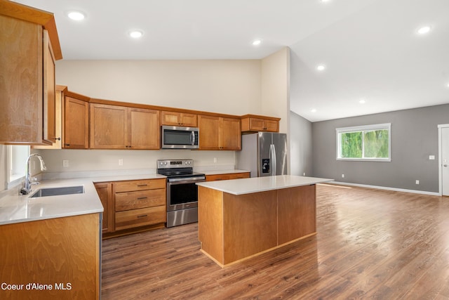 329 N 20th, Saint Maries, ID 83861 - kitchen with appliances with stainless steel finishes, a sink, a center island, high vaulted ceiling, and dark wood-type flooring