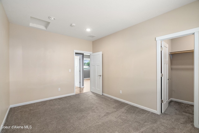 329 N 20th, Saint Maries, ID 83861 - unfurnished bedroom with carpet floors, a spacious closet, baseboards, a closet, and recessed lighting