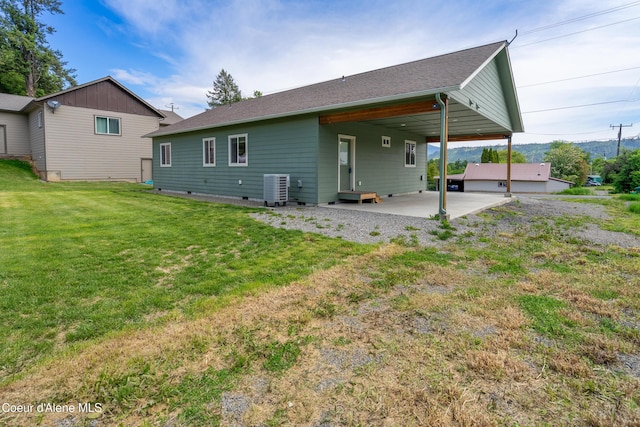329 N 20th, Saint Maries, ID 83861 - back of property featuring cooling unit, a yard, and an attached carport