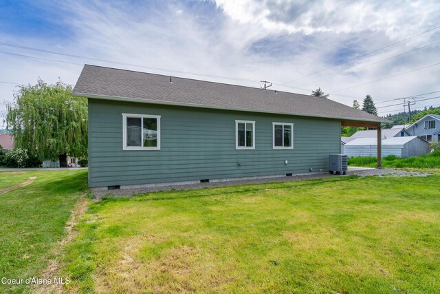 329 N 20th, Saint Maries, ID 83861 - rear view of house with crawl space, a lawn, central AC, and a shingled roof