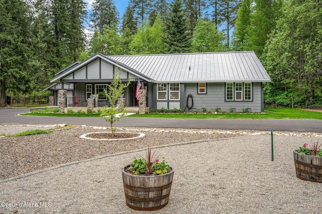 view of front of house featuring a porch and metal roof