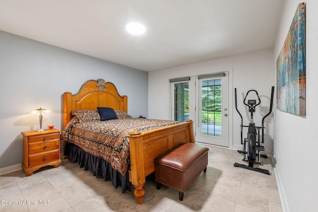 bedroom featuring access to outside and baseboards