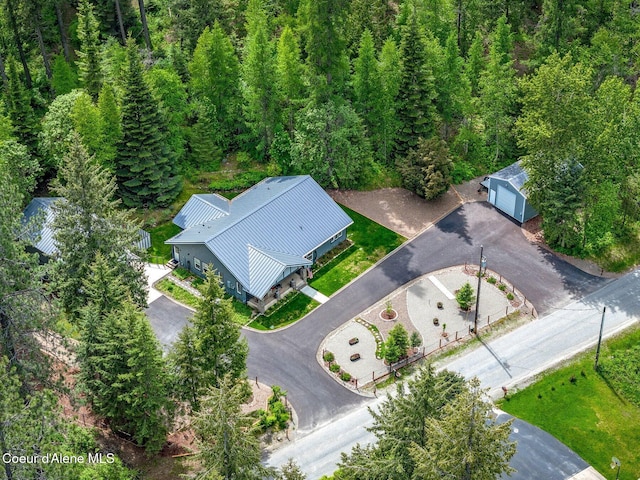 view of subject property with a forest