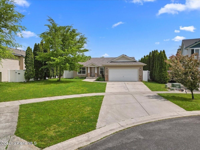 3459 E White Sands Ln, Post Falls, ID 83854 - view of front of home with a garage, concrete driveway, and brick siding
