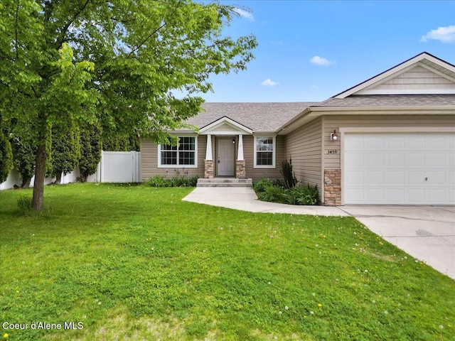 3459 E White Sands Ln, Post Falls, ID 83854 - single story home featuring concrete driveway, an attached garage, stone siding, and roof with shingles