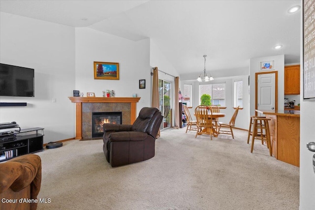 3459 E White Sands Ln, Post Falls, ID 83854 - carpeted living room featuring lofted ceiling, a chandelier, a tile fireplace, recessed lighting, and baseboards