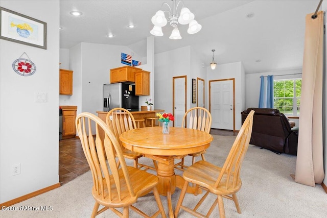 3459 E White Sands Ln, Post Falls, ID 83854 - dining area with a chandelier, light carpet, high vaulted ceiling, baseboards, and recessed lighting