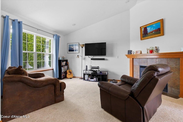 3459 E White Sands Ln, Post Falls, ID 83854 - carpeted living room featuring lofted ceiling and a tiled fireplace