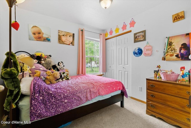 3459 E White Sands Ln, Post Falls, ID 83854 - bedroom with carpet flooring, a closet, and baseboards