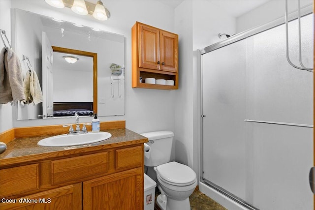3459 E White Sands Ln, Post Falls, ID 83854 - bathroom featuring ensuite bath, toilet, a stall shower, and vanity