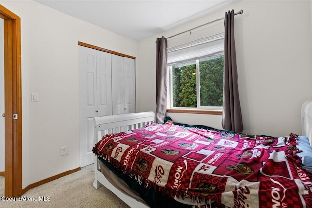 3459 E White Sands Ln, Post Falls, ID 83854 - bedroom featuring light carpet, a closet, and baseboards