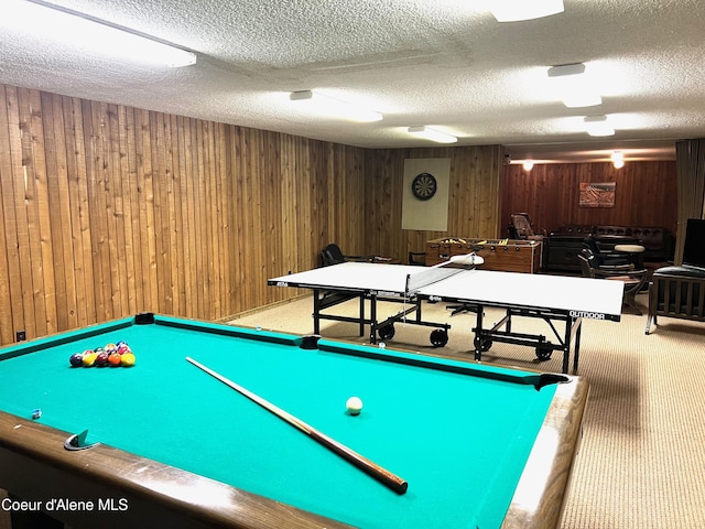 495 NW Psge # 103, Sandpoint, ID 83864 - rec room with wood walls, carpet, and a textured ceiling