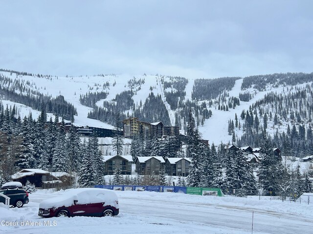 495 NW Psge # 103, Sandpoint, ID 83864 - snow covered property featuring a mountain view