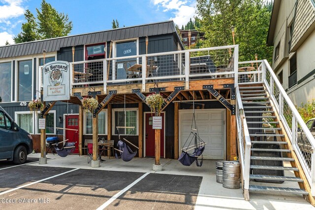 495 NW Psge # 103, Sandpoint, ID 83864 - view of building exterior with stairs and an attached garage