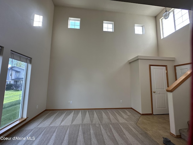 1374 N Kaleigh Ct, Coeur Dalene, ID 83814 - spare room featuring a towering ceiling, carpet floors, and stairway