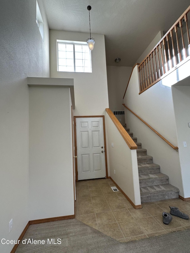 1374 N Kaleigh Ct, Coeur Dalene, ID 83814 - stairway with a towering ceiling and tile patterned flooring
