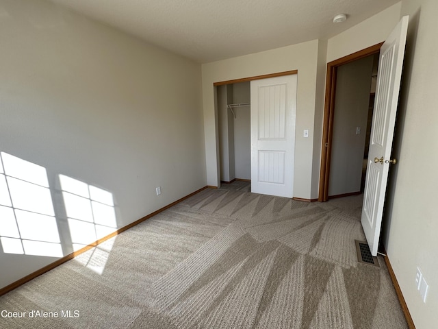 1374 N Kaleigh Ct, Coeur Dalene, ID 83814 - unfurnished bedroom featuring carpet and a closet