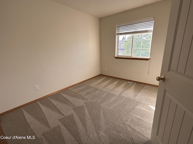 1374 N Kaleigh Ct, Coeur Dalene, ID 83814 - empty room featuring light colored carpet and baseboards