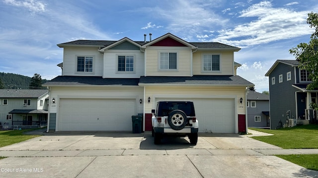 1374 N Kaleigh Ct, Coeur Dalene, ID 83814 - traditional-style house with an attached garage and driveway