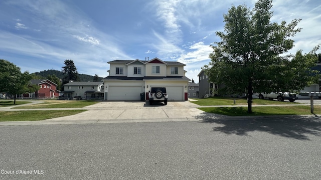 1374 N Kaleigh Ct, Coeur Dalene, ID 83814 - traditional-style house with a garage, driveway, and a front lawn