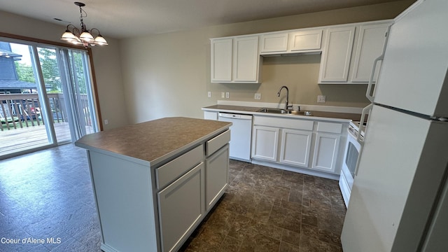 1374 N Kaleigh Ct, Coeur Dalene, ID 83814 - kitchen featuring white appliances, a kitchen island, white cabinets, and a chandelier