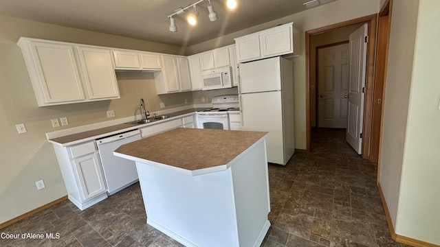 1374 N Kaleigh Ct, Coeur Dalene, ID 83814 - kitchen with white appliances, dark stone finish floors, and white cabinets