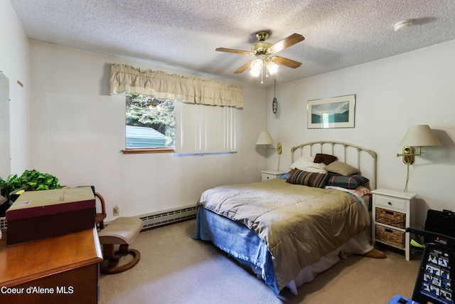 carpeted bedroom with baseboard heating, a textured ceiling, and ceiling fan