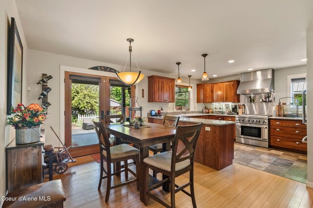 619 N Florence Ave, Sandpoint, ID 83864 - dining room featuring plenty of natural light, light wood-type flooring, and recessed lighting
