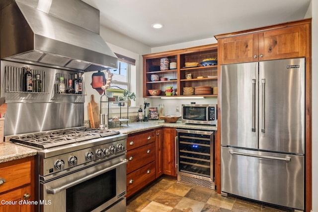 619 N Florence Ave, Sandpoint, ID 83864 - kitchen with high end appliances, wine cooler, wall chimney exhaust hood, open shelves, and light stone countertops