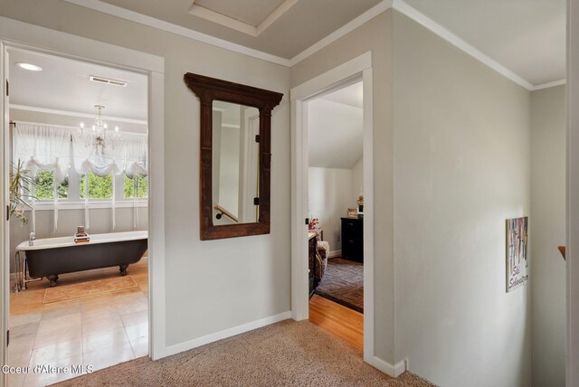 619 N Florence Ave, Sandpoint, ID 83864 - hall with baseboards, crown molding, a chandelier, and carpet flooring