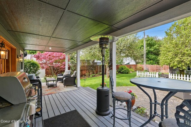 619 N Florence Ave, Sandpoint, ID 83864 - wooden terrace featuring area for grilling, a patio area, and outdoor lounge area