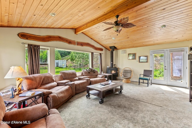 carpeted living room with a wood stove, wooden ceiling, a ceiling fan, and french doors