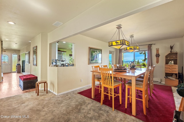 carpeted dining space featuring baseboards, recessed lighting, and a baseboard heating unit