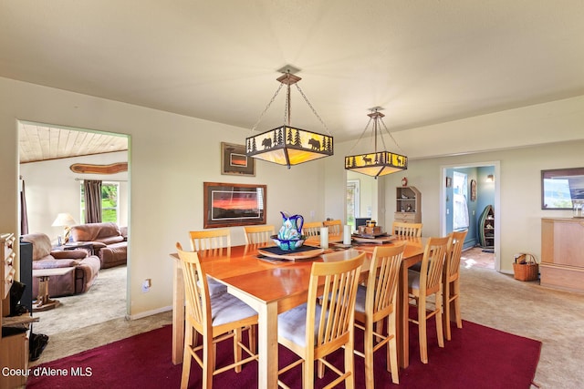 dining area featuring carpet