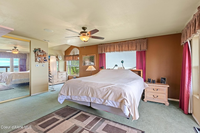 carpeted bedroom featuring baseboards and ceiling fan