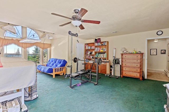 workout room featuring carpet floors and ceiling fan