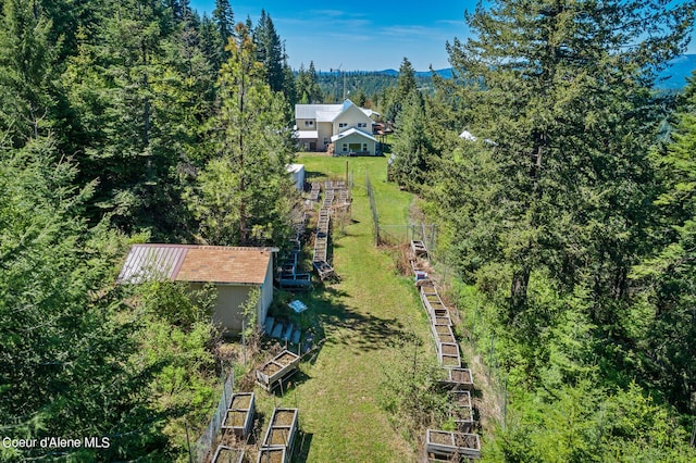 view from above of property with a forest