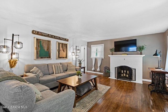 908 E Coeur D Alene Ave, Coeur Dalene, ID 83814 - living room featuring hardwood / wood-style floors, baseboards, and a fireplace