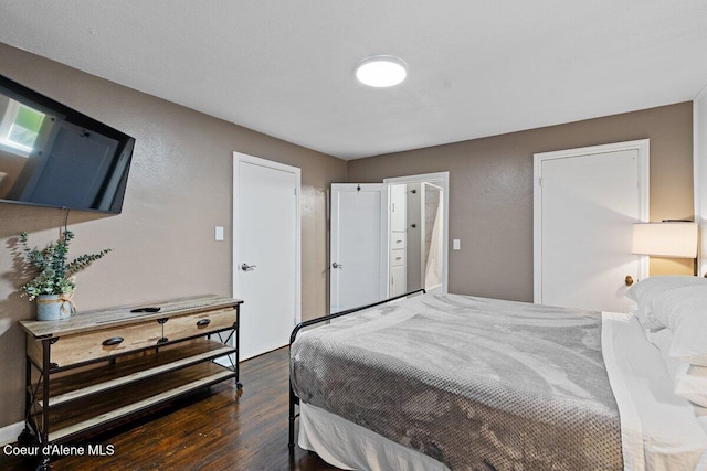 908 E Coeur D Alene Ave, Coeur Dalene, ID 83814 - bedroom with wood finished floors and a textured wall
