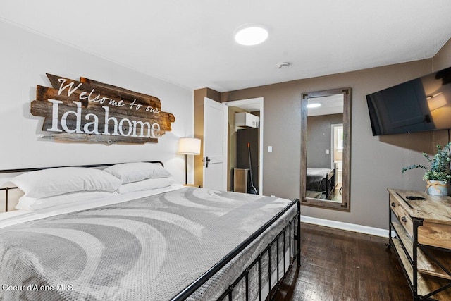 908 E Coeur D Alene Ave, Coeur Dalene, ID 83814 - bedroom featuring dark wood-style flooring and baseboards