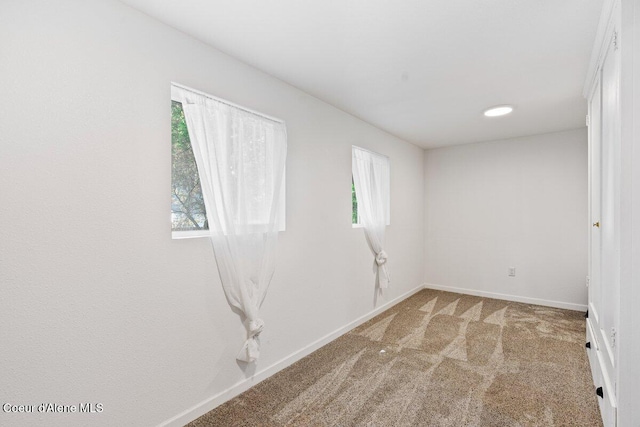 908 E Coeur D Alene Ave, Coeur Dalene, ID 83814 - unfurnished room featuring carpet flooring, plenty of natural light, and baseboards