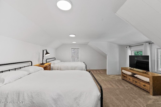 908 E Coeur D Alene Ave, Coeur Dalene, ID 83814 - bedroom featuring carpet floors and vaulted ceiling