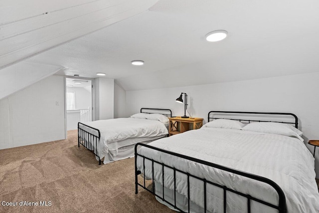 908 E Coeur D Alene Ave, Coeur Dalene, ID 83814 - bedroom featuring carpet floors and lofted ceiling