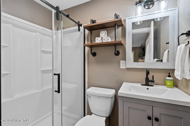 908 E Coeur D Alene Ave, Coeur Dalene, ID 83814 - full bath with a textured wall, a shower stall, toilet, and vanity